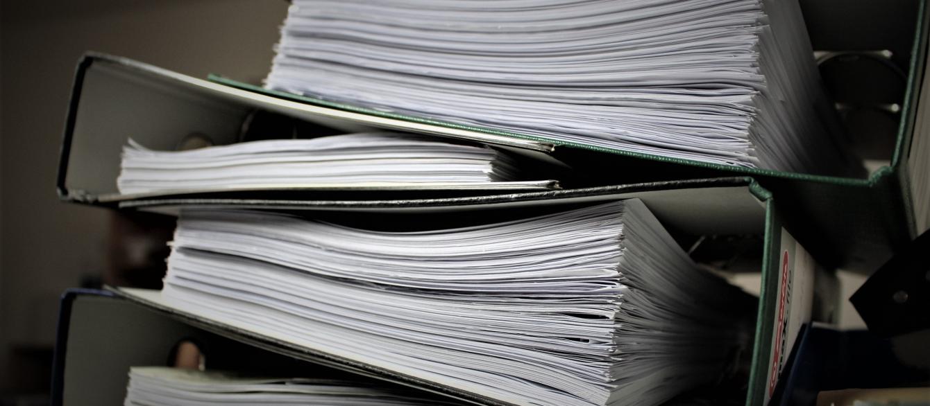 archival notebooks filled with documents