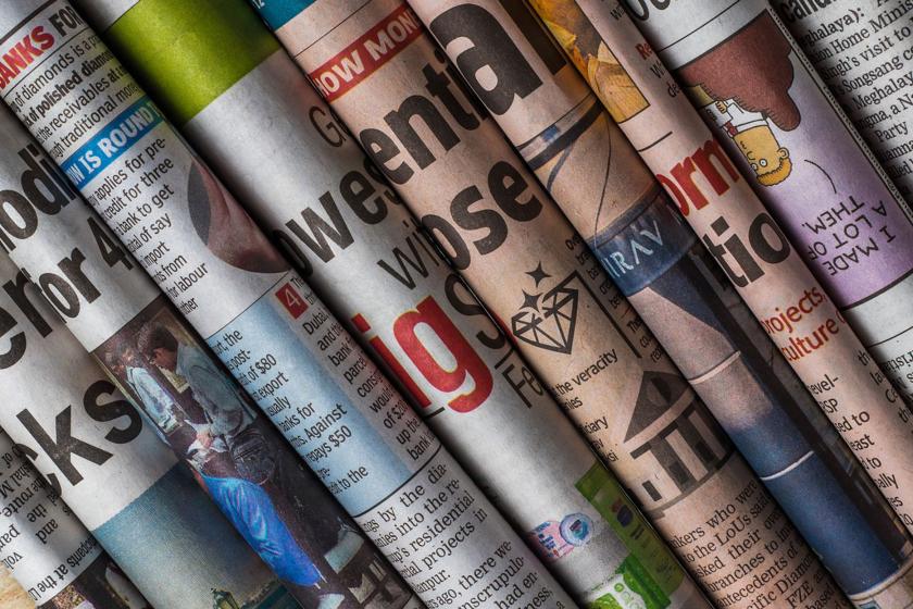 Rolled up newspapers